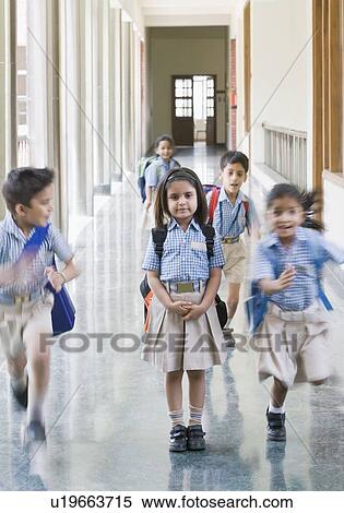 Students running in a corridor View Large Photo Image Stock Photography - Students running in a corridor. Fotosearch