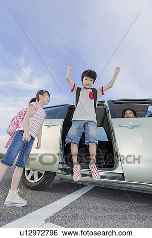 Boy Jumping Out of a Car View Large Photo Image Stock Photograph - Boy Jumping Out of a Car. Fotosearch