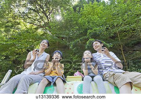 Family Enjoying Picnic View Large Photo Image Stock Photograph - Family Enjoying Picnic. Fotosearch