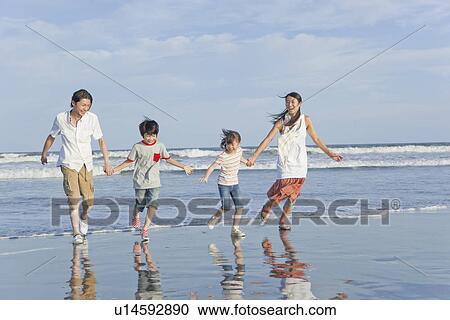 Family Playing at Beach View Large Photo Image Stock Image - Family Playing at Beach. Fotosearch