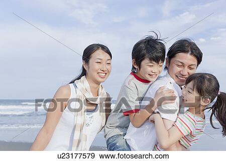 Family Playing at Beach View Large Photo Image Stock Photo - Family Playing at Beach. Fotosearch