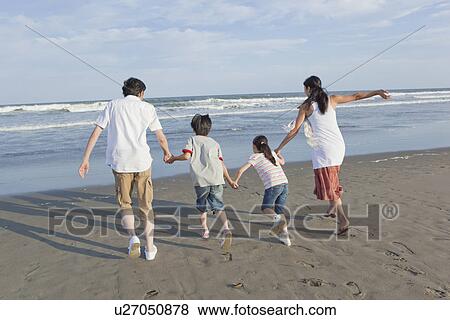 Family Running at Beach View Large Photo Image Stock Photo - Family Running at Beach. Fotosearch