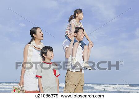 Family Standing at Beach View Large Photo Image Stock Photo - Family Standing at Beach. Fotosearch
