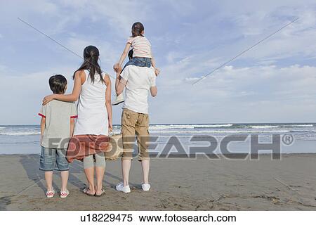Family Standing at Beach View Large Photo Image Stock Photography - Family Standing at Beach. Fotosearch