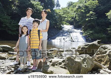 Family Standing by Mountain Stream View Large Photo Image Stock Image - Family Standing by Mountain Stream. Fotosearch