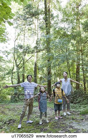 Family Taking a Deep Breath in the Woods View Large Photo Image Stock Photo - Family Taking a Deep Breath in the Woods. Fotosearch