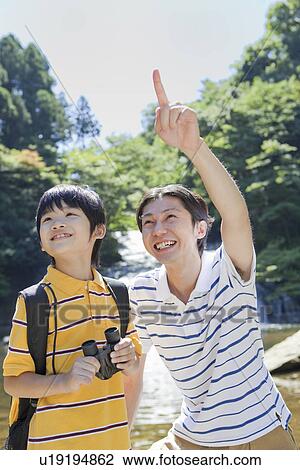 Father and Son Talking at Riverside View Large Photo Image Stock Image - Father and Son Talking at Riverside. Fotosearch