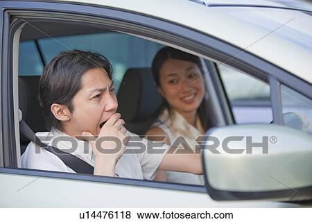 Young Man Yawning at Driver's Seat View Large Photo Image Stock Photo - Young Man Yawning at Driver's Seat. Fotosearch