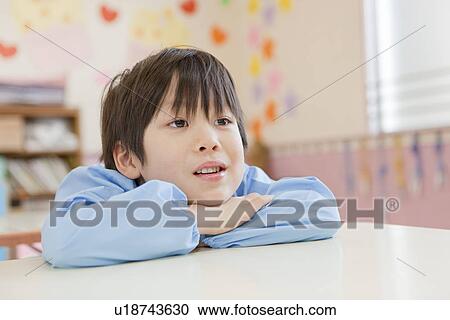 Stock Image - Kindergarten Boy Having Board Face. Fotosearch