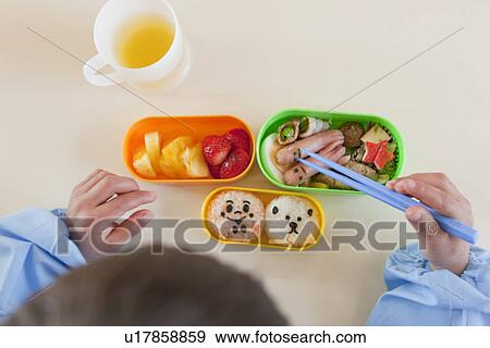 Stock Photo - Kindergarten Boy Having Lunch. Fotosearch