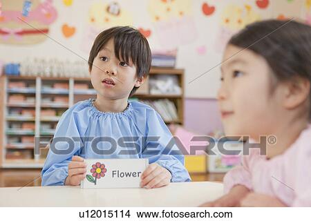 Picture - Kindergarten Boy Holding Picture Card. Fotosearch