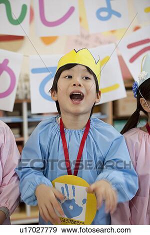 Stock Photo - Kindergarten Boy Singing. Fotosearch