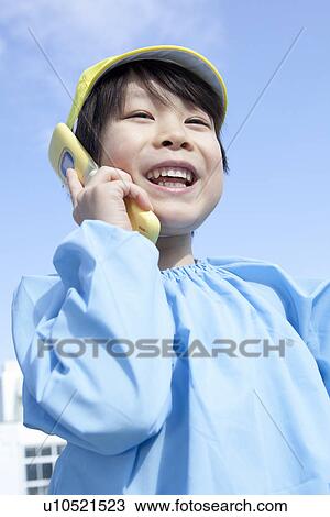Stock Image - Kindergarten Boy Talking on Cellular Phone. Fotosearch