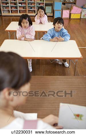 Kindergarten Children Listening Teacher's Talk View Large Photo Image Stock Image - Kindergarten Children Listening Teacher's Talk. Fotosearch