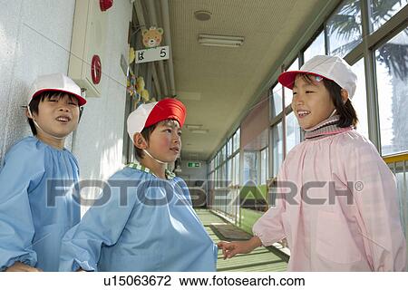 Stock Image - Kindergarten Children Playing at Hallway. Fotosearch