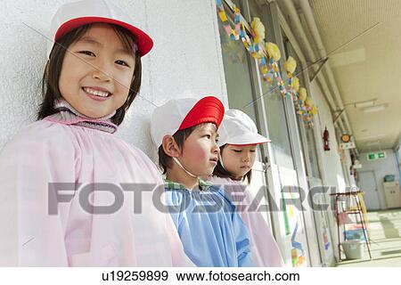 Stock Photo - Kindergarten Children Standing at Hallway. Fotosearch