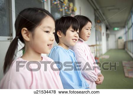 Stock Photo - Kindergarten Children Standing at Hallway. Fotosearch