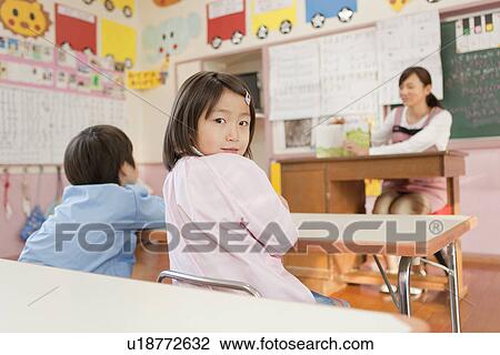 Stock Image - Kindergarten Girl Looking Back. Fotosearch