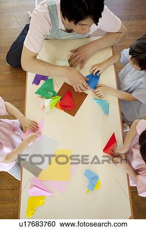 Kindergarten Teacher and Children Playing Origami View Large Photo Image Stock Image - Kindergarten Teacher and Children Playing Origami. Fotosearch