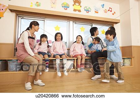 Kindergarten Teacher and Children Playing View Large Photo Image Stock Photograph - Kindergarten Teacher and Children Playing. Fotosearch