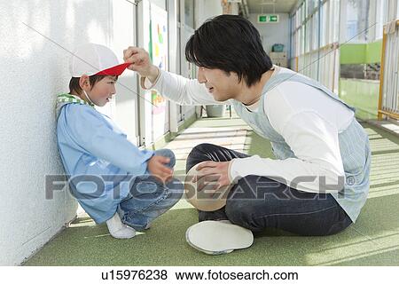Kindergarten Teacher Talking to Boy View Large Photo Image Stock Photo - Kindergarten Teacher Talking to Boy. Fotosearch