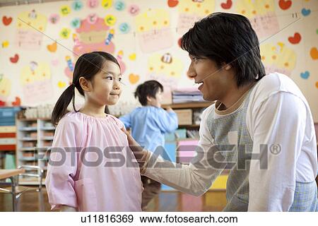 Kindergarten Teacher Talking to Girl View Large Photo Image Stock Photo - Kindergarten Teacher Talking to Girl. Fotosearch