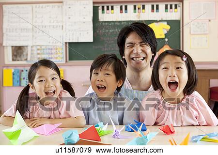 Stock Photo - Kindergarten Teacher with Children. Fotosearch