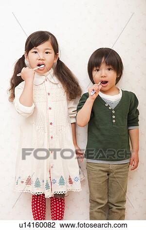 Boy and Girl Brushing Teeth View Large Photo Image Stock Image - Boy and Girl Brushing Teeth . Fotosearch