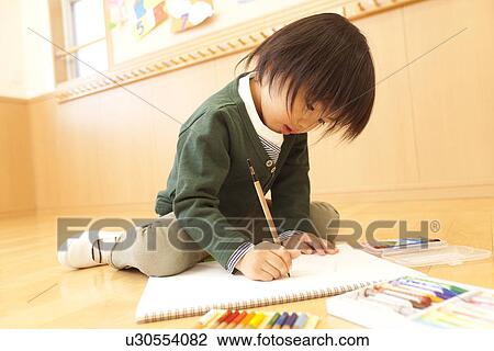 Stock Image - Boy Painting. Fotosearch