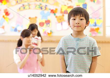 Boy Standing at Child Day-care Center View Large Photo Image Stock Image - Boy Standing at Child Day-care Center. Fotosearch