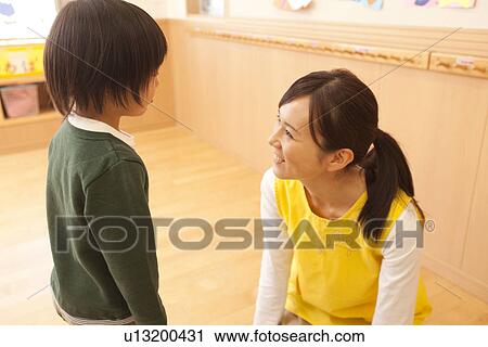 Boy Talking to Nursery Teacher View Large Photo Image Stock Image - Boy Talking to Nursery Teacher. Fotosearch