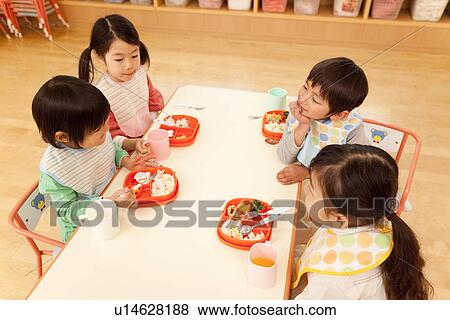 Stock Photo - Children Having School Lunch. Fotosearch