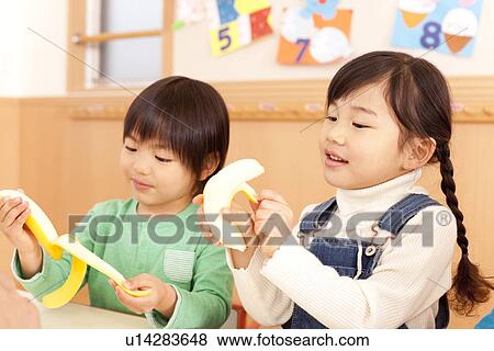 Children Peeling Banana View Large Photo Image Stock Photo - Children Peeling Banana. Fotosearch