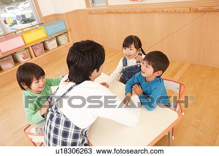 Children Playing with Nursery Teacher View Large Photo Image Stock Image - Children Playing with Nursery Teacher. Fotosearch