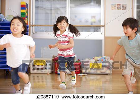 Stock Photo - Children Running at Day-care Center. Fotosearch