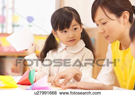 Girl Looking at Nursery Teacher View Large Photo Image Stock Photo - Girl Looking at Nursery Teacher. Fotosearch