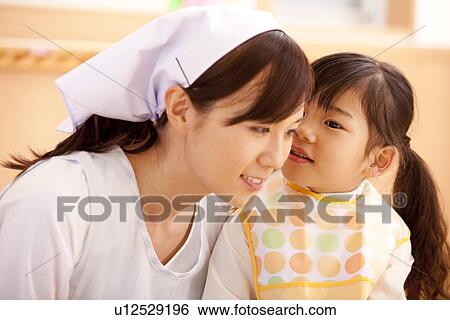 Girl Talking to Nursery Teacher View Large Photo Image Stock Photograph - Girl Talking to Nursery Teacher. Fotosearch