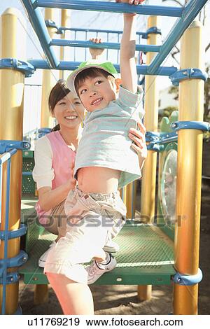 Nursery Teacher and Boy Playing View Large Photo Image Stock Photo - Nursery Teacher and Boy Playing. Fotosearch