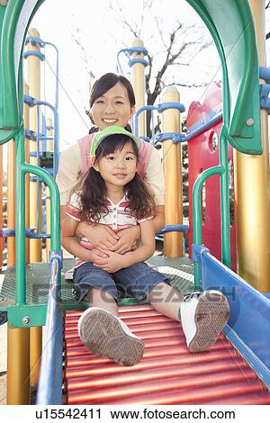 Nursery Teacher and Girl Playing View Large Photo Image Stock Image - Nursery Teacher and Girl Playing. Fotosearch