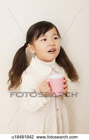 Stock Image - One Girl Gargling. Fotosearch