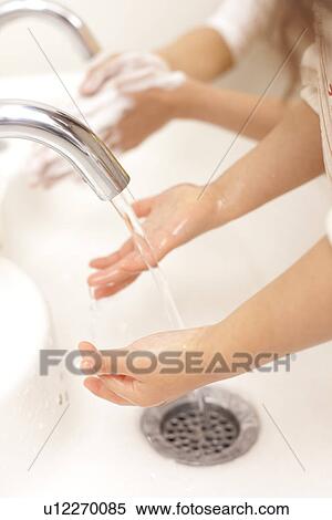 Stock Photography - Part of Human Hand Washing. Fotosearch
