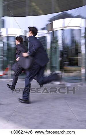 Two businessmen running fast View Large Photo Image Stock Photograph - Two businessmen running fast. Fotosearch