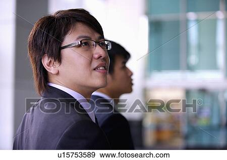 Young man looking up with smile View Large Photo Image Stock Photo - Young man looking up with smile. Fotosearch