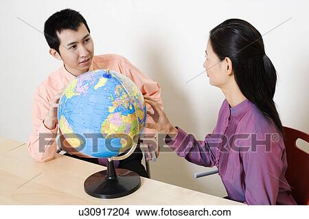 Businesswoman discussing with a businessman View Large Photo Image Picture - Businesswoman discussing with a businessman. Fotosearch