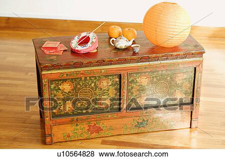 Stock Photo - Chinese lantern and a kettle with envelopes on the table. Fotosearch