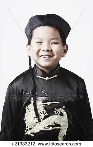 Close-up of a boy looking sideways smiling View Large Photo Image Stock Image - Close-up of a boy looking sideways smiling. Fotosearch