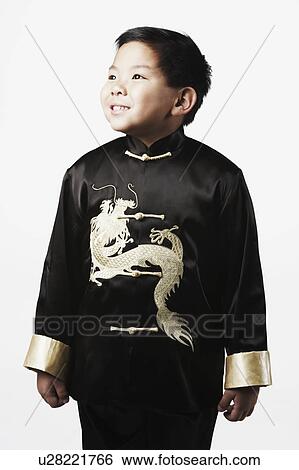 Stock Photograph - Close-up of a boy looking up thinking. Fotosearch