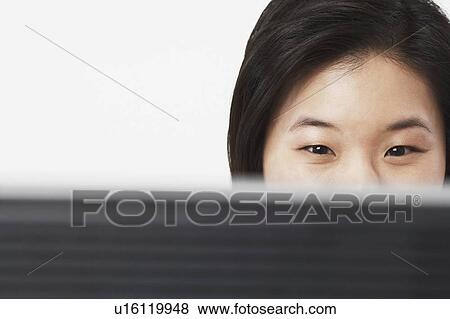 Close-up of a businesswoman in front of a computer View Large Photo Image Stock Photo - Close-up of a businesswoman in front of a computer. Fotosearch
