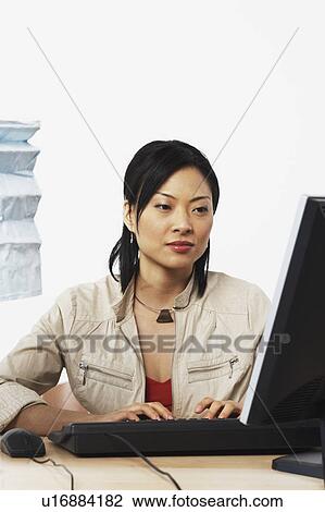 Close-up of a businesswoman using a computer View Large Photo Image Stock Image - Close-up of a businesswoman using a computer. Fotosearch
