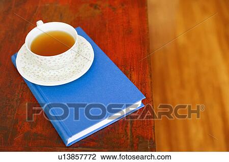 Close-up of a cup on a diary View Large Photo Image Stock Image - Close-up of a cup on a diary. Fotosearch